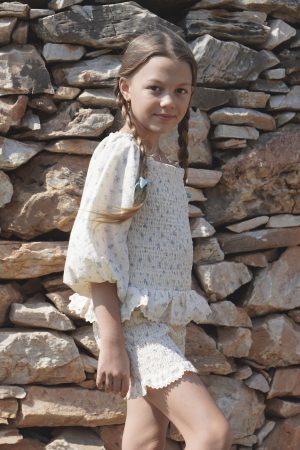 girl wearing the Lois Blouse in a floral Fleur Bleue cotton fabric, paired with the matching Poppi Shorts by the sustainable brand House of Paloma, curated by Morsel Store