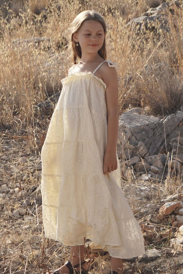 girl wearing the Sonnet Dress in cotton Creme Broderie fabric by the sustainable brand House of Paloma, curated by Morsel Store