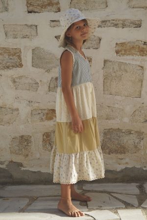 girl wearing the Valentina Dress in cotton melange paired with the Hydra Sun hat in a floral Fleur Bleue fabric by the sustainable brand House of Paloma, curated by Morsel Store