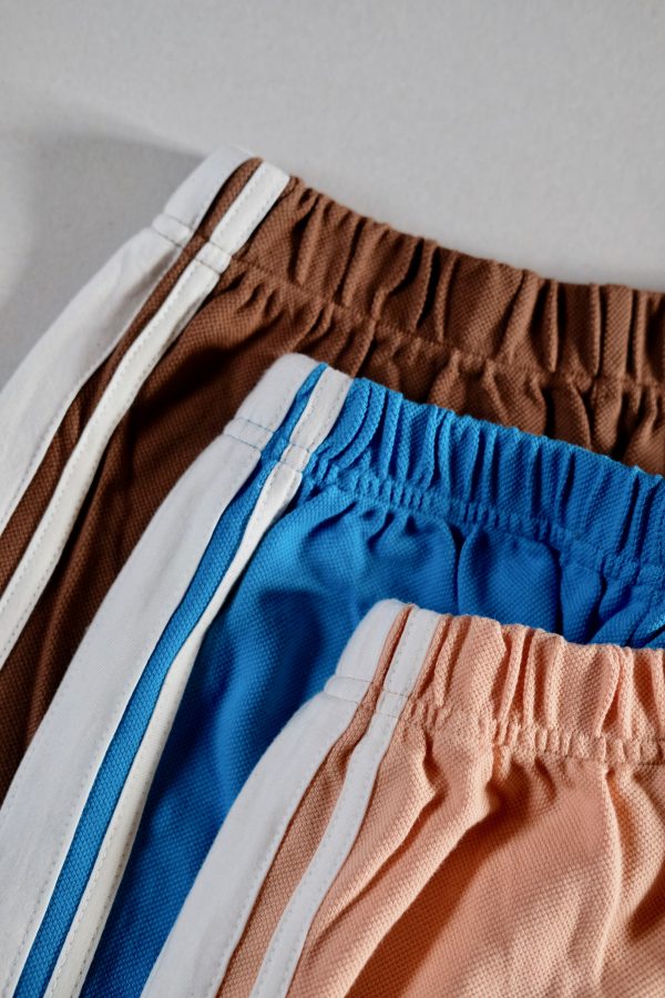 the Racer Pants in Cocoa Brown, Sonic & Peach by the brand Summer and Storm, curated by Morsel Store