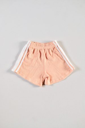 the Racer Terry Shorts in Peach by the brand Summer and Storm, curated by Morsel Store