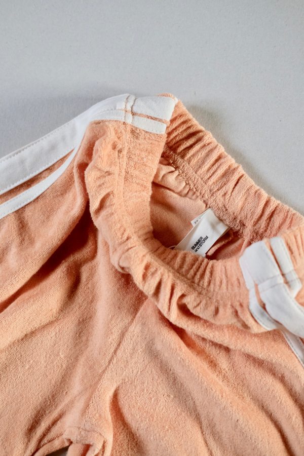 the Racer Terry Shorts in Peach by the brand Summer and Storm, curated by Morsel Store