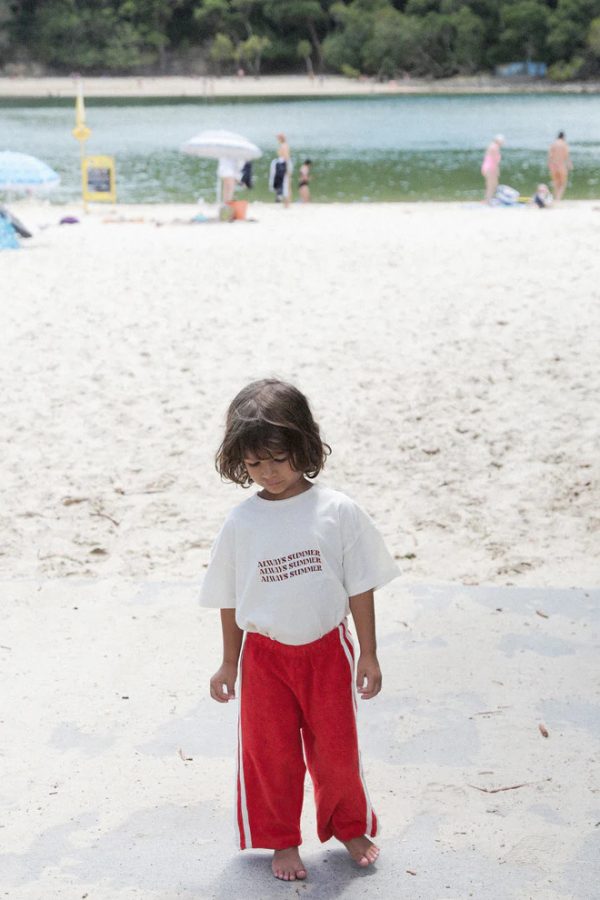 Boy wearing the Oversized Tee in Natural printed with Always Summer by the brand Summer and Storm, curated by Morsel Store