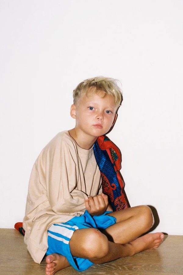 boy wearing the Oversized Tee in Ginger paired with the Racer Shorts in Blue by the brand Summer and Storm, curated by Morsel Store