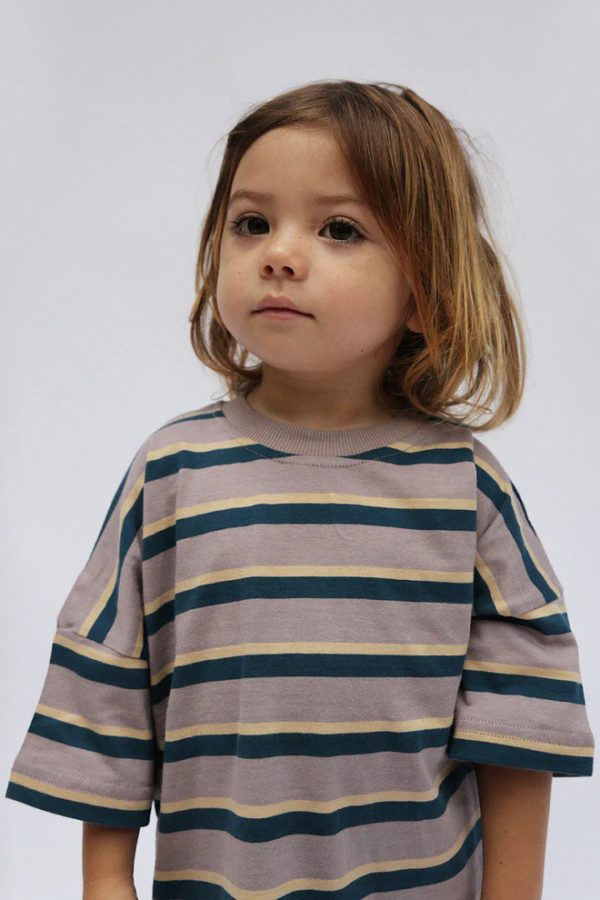 boy wearing the Oversized Tee in Mauve Retro Stripe by the brand Summer and Storm, curated by Morsel Store