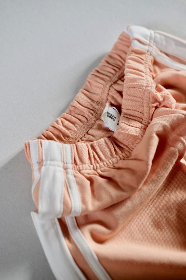 the Racer Pants in Peach by the brand Summer and Storm, curated by Morsel Store