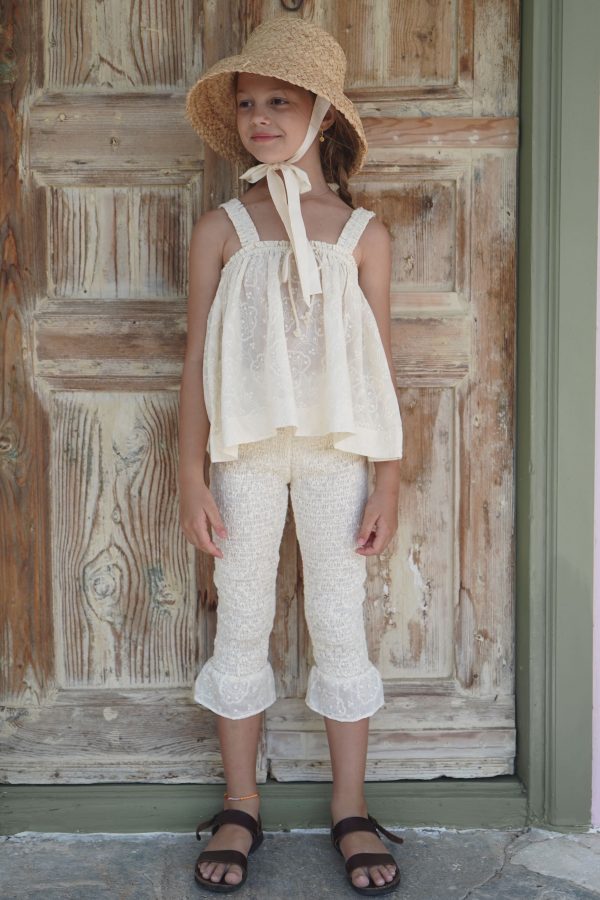 the cotton Edith Top in Creme Broderie paired with the matching Zadie Pants and Jean Belle Raffia Hat by the sustainable brand House of Paloma, curated by Morsel Store