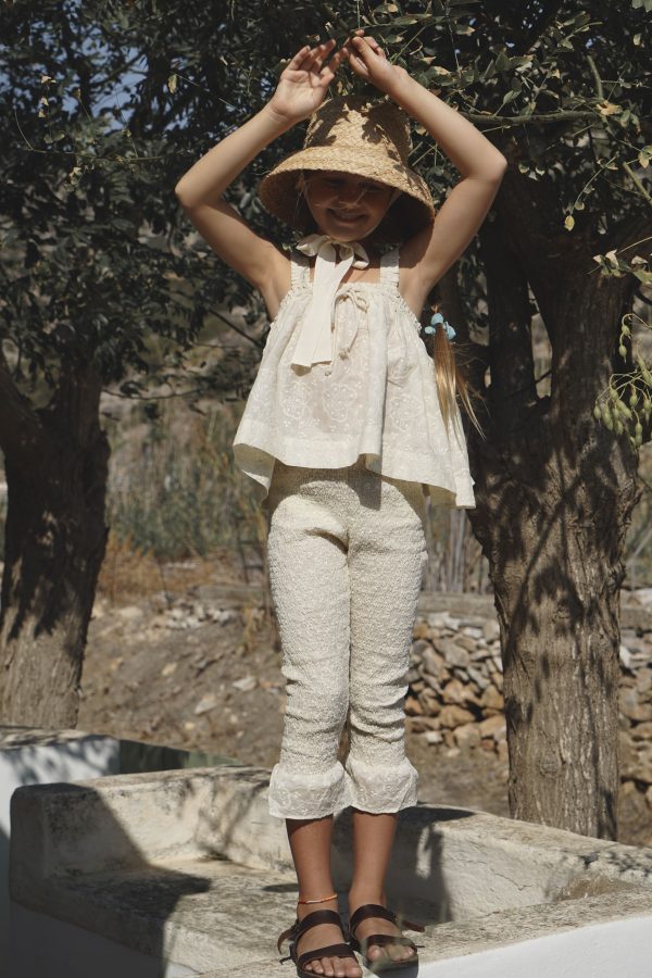 the cotton Edith Top in Creme Broderie paired with the matching Zadie Pants and Jean Belle Raffia Hat by the sustainable brand House of Paloma, curated by Morsel Store