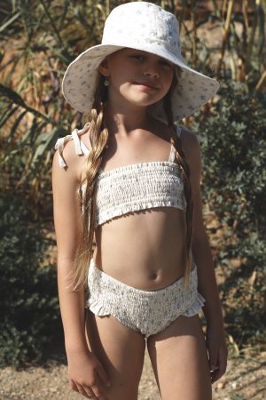 girl wearing the Ula Set in Fleur Bleue Cotton paired with the matching Hydra Hat by the sustainable brand House of Paloma, curated by Morsel Store