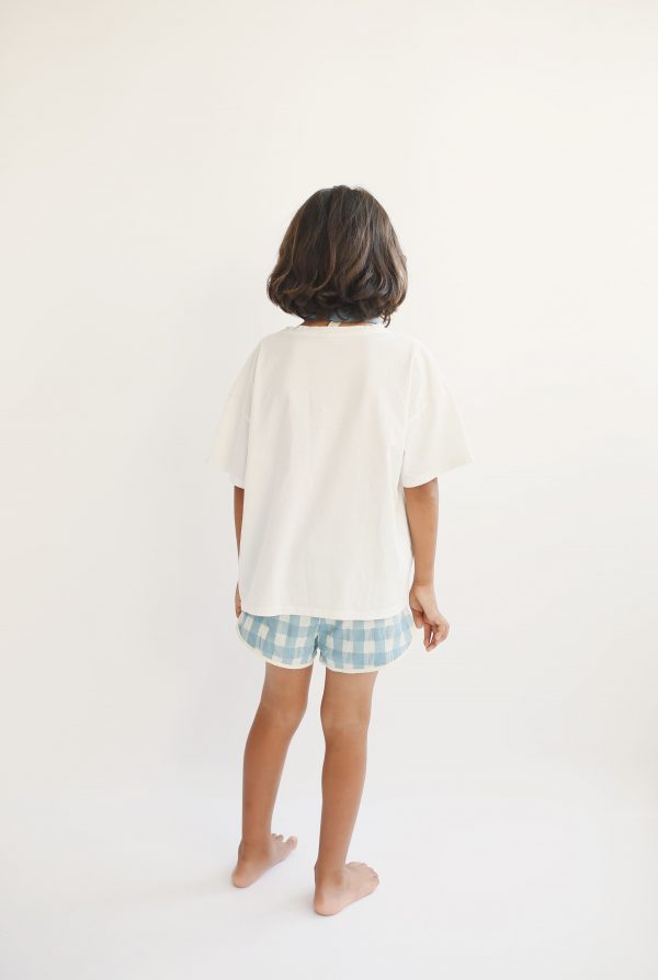 boy wearing the Swim Shorts in Blue/Tea by the sustainable brand LiiLU, curated by Morsel Store, located on Mallorca