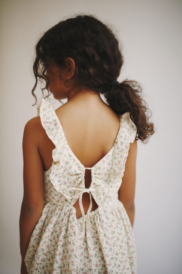 girl wearing the Yumi Dress in Ecru Floral by the sustainable brand LiiLU, curated by Morsel Store, located on Mallorca