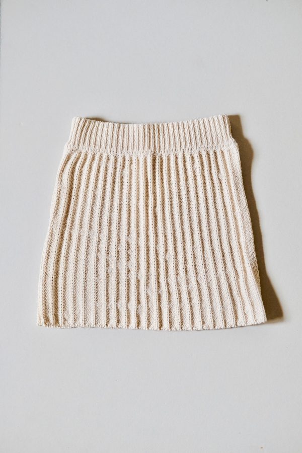 the hand knitted Lapas Mini Skirt in Oat Milk by the brand The Knotty Ones, curated by Morsel Store