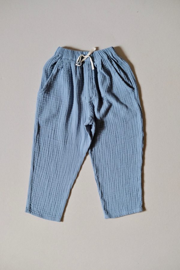 the Levi Pant in Storm Blue organic muslin cotton by the sustainable brand LiiLU, curated by Morsel Store located on Mallorca