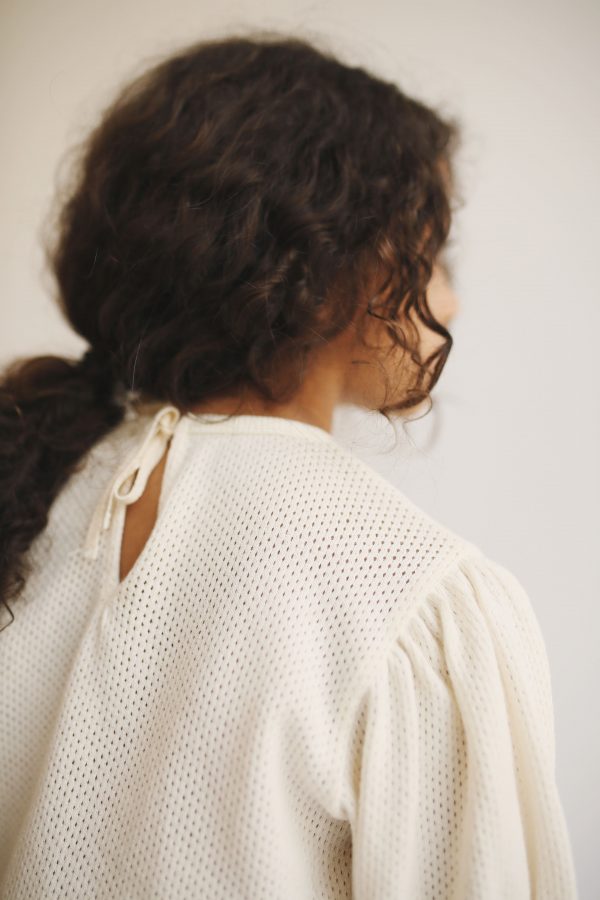 girl wearing the Jala Blouse in Ecru organic cotton by the sustainable brand LiiLu, curated by Morsel Store, located on Mallorca