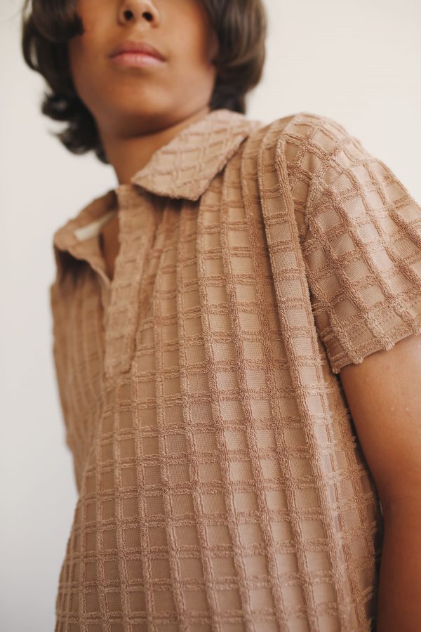 boy wearing the Lio Polo in Chestnut organic cotton by the sustainable brand LiiLU, curated by Morsel Store, located on Mallorca