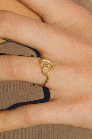 woman wearing the Belen Ring in gold by the sustainable jewellery brand Agapé Studio, curated by Morsel Store