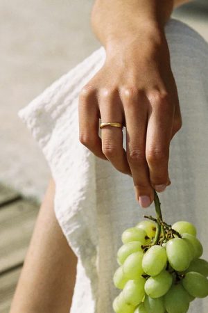 woman wearing the Bellina Ring in gold by the sustainable jewellery brand Agapé Studio, curated by Morsel Store