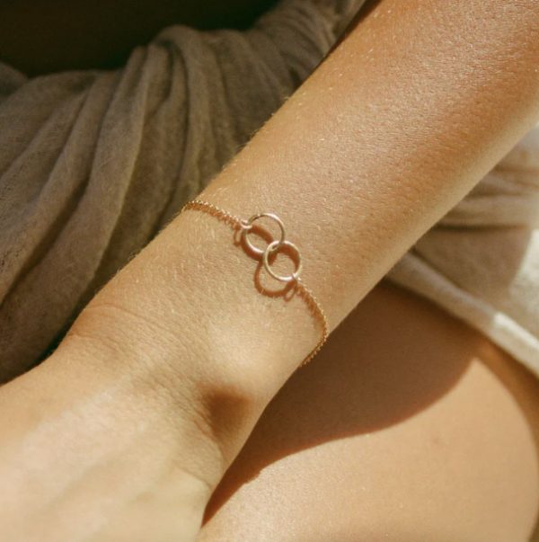 woman wearing the Cira Bracelet in gold by the sustainable brand Agapé Studio, curated by Morsel Store