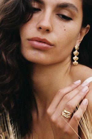 woman wearing the Lina Ring in gold by the sustainable jewelry brand Agapé Studio, curated by Morsel Store