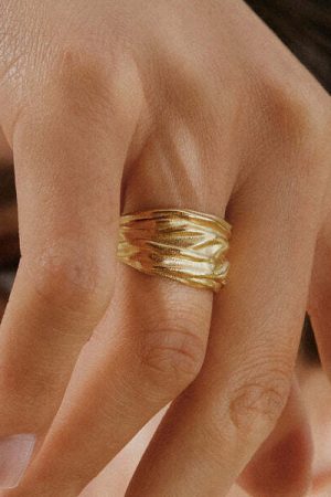 woman wearing the Lina Ring in gold by the sustainable jewelry brand Agapé Studio, curated by Morsel Store