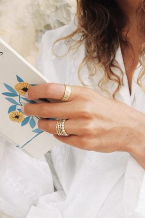 woman wearing the Mila Ring in gold by the sustainable jewelry brand Agapé Studio, curated by Morsel Store