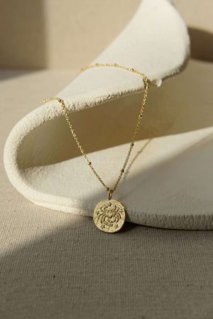 the gold plated zodiac necklaces - Cancer - by the sustainable jewellery brand Agapé Studio, curated by Morsel Store