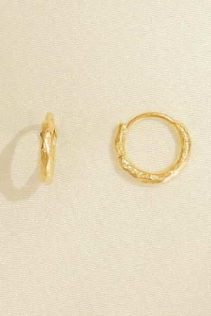 the Gina Earrings in gold by the sustainable jewelry brand Agapé Studio (now Agapée), curated by Morsel Store