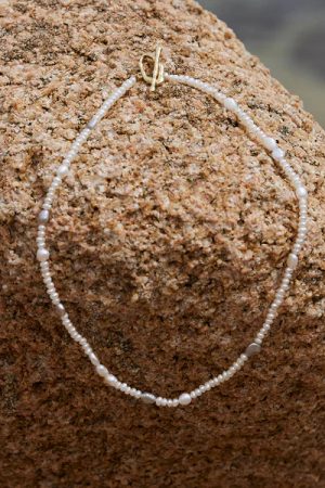 the Oia Choker Necklace in white and gray freshwater pearls by the sustainable jewelry brand Agapé Studio (now Agapée), curated by Morsel Store