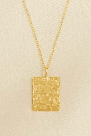 the Tia Necklace in gold by the sustainable jewelry brand Agapé Studio, curated by Morsel Store