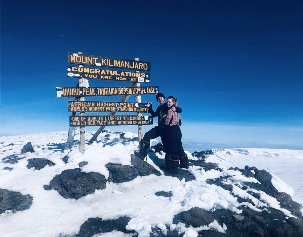 Standing on top of Mount Kilimanjaro, Tanzania