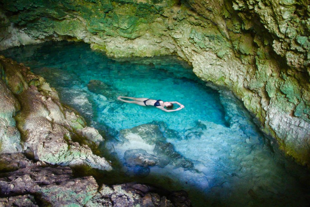 Swimming in Kuza Cave in Zanzibar