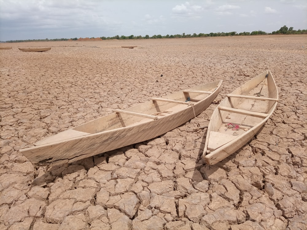 Boats on a dried-up riverbed