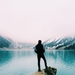 person standing near the ocean