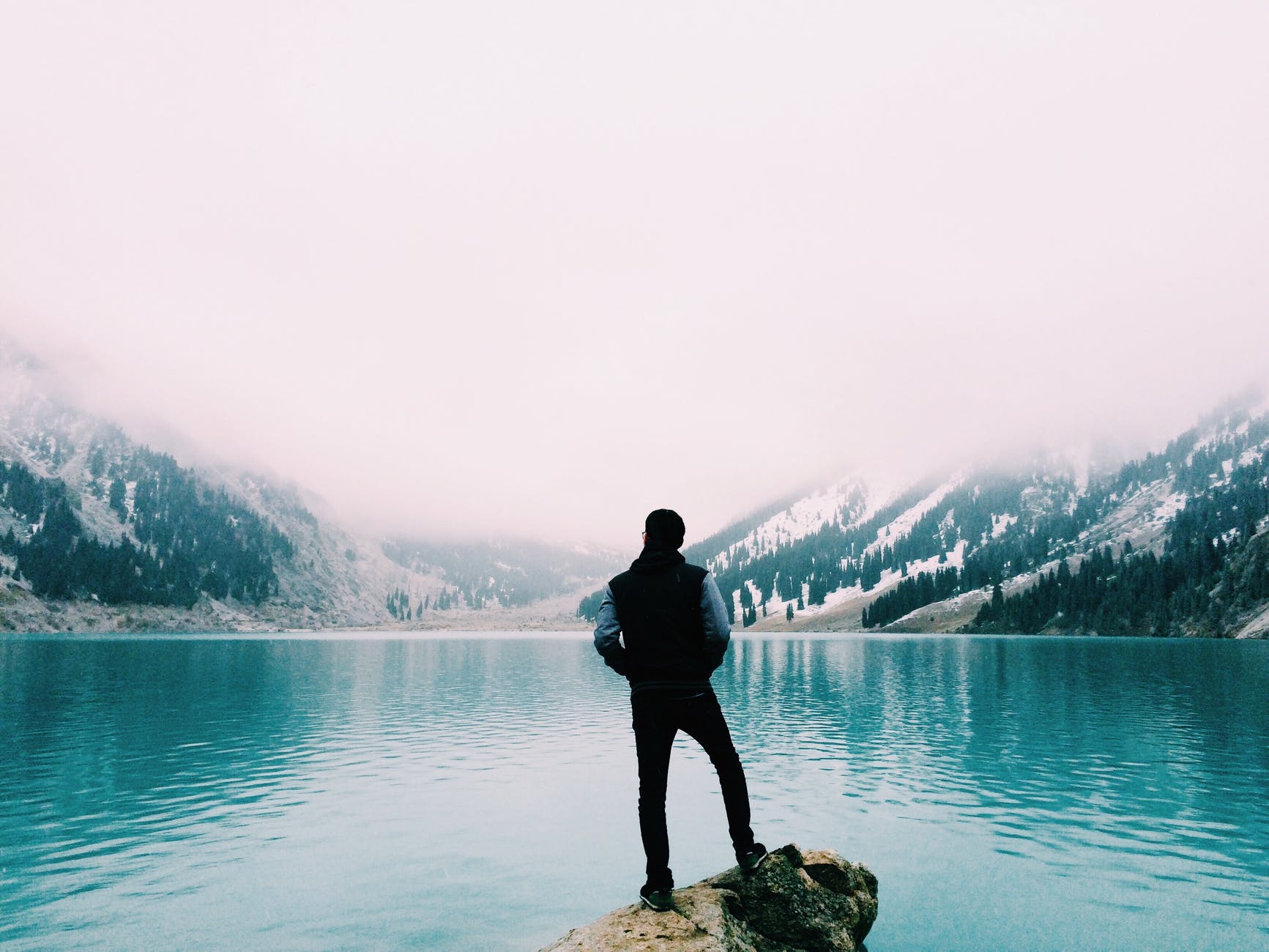 person standing near the ocean