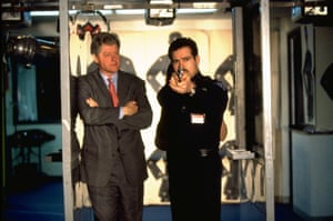 Bill Clinton, then the US president, watches a student police officer at shooting practice