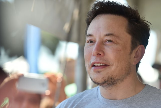 (FILES) In this file photo taken on July 22, 2018, SpaceX, Tesla and The Boring Company founder Elon Musk attends the 2018 SpaceX Hyperloop Pod Competition in Hawthorne, California. - SpaceX CEO Elon Musk has unveiled the first pictures of a retro-looking, steely rocket called Starship that may one day carry people to the Moon and Mars. Musk posted pictures on Twitter late Thursday, January 10, 2019, of the test version of the Starship Hopper, which awaits its first flight test in Texas in the coming weeks. (Photo by Robyn Beck / AFP)ROBYN BECK/AFP/Getty Images