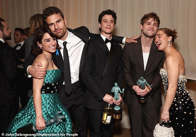 Group shot: Theo cuddled up to his co-star Simona Tabasco as they posed with Adam DiMarco, Leo Woodall and Haley Lu Richardson
