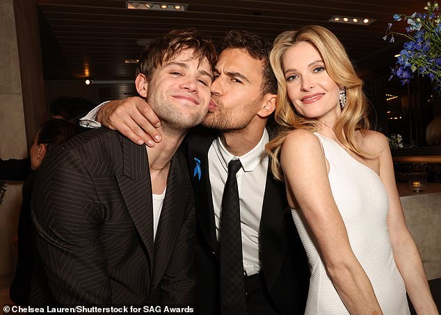 Three's a crowd? The actors were stood with Leo's rumoured love interest Meghann Fahy, who he has reportedly been dating since they met on the set of the black comedy-drama
