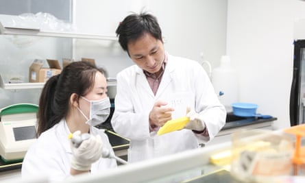 He Jiankui instructing a laboratory staff member  