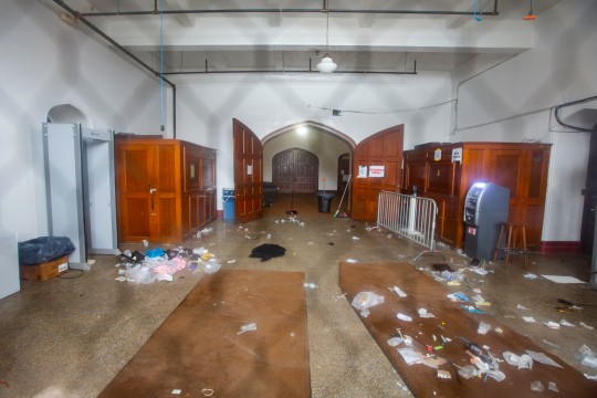 Debris is seen in the main entrance of Main Street Armory on Monday, March 6, 2023, in Rochester, N.Y following a stampede that has left two dead and several injured