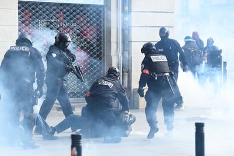 Police detain a protester during clashes on the sidelines of a demonstration in Nantes today