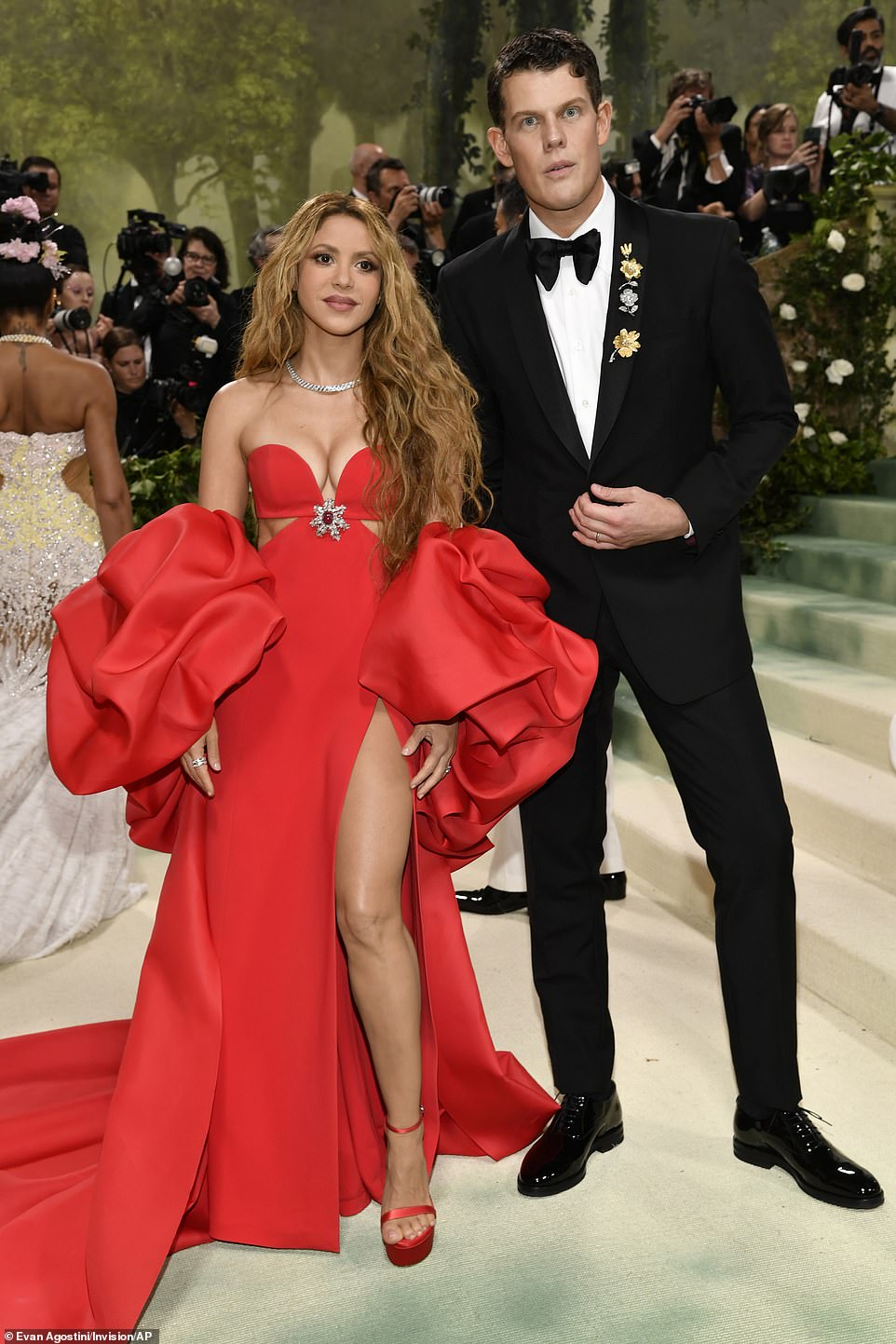 Shakira wowed in a bold red gown with matching heels; pictured with Wes Gordon
