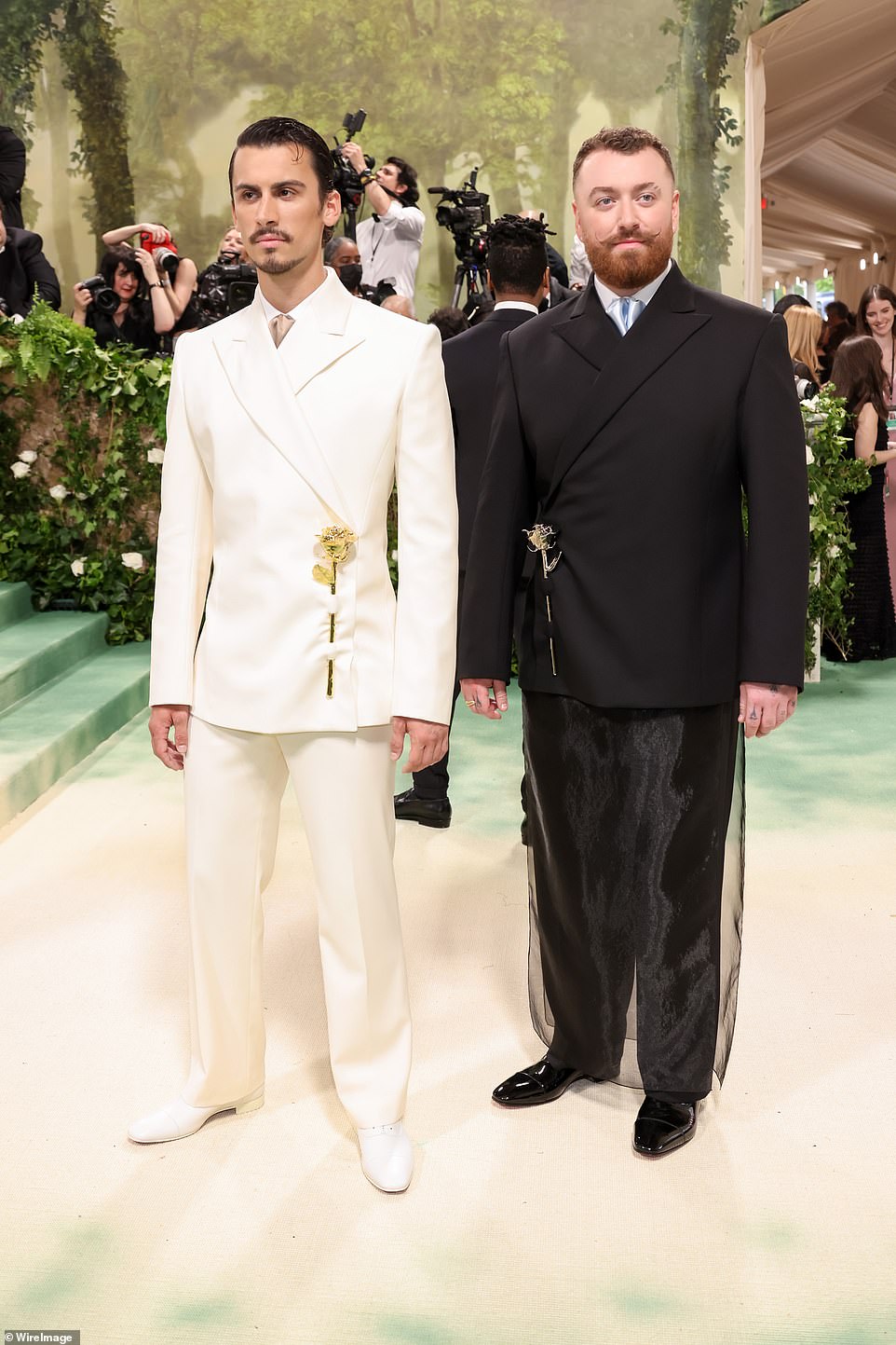 Sam Smith donned a striking black look while Christian Cowan wore a crisp white look