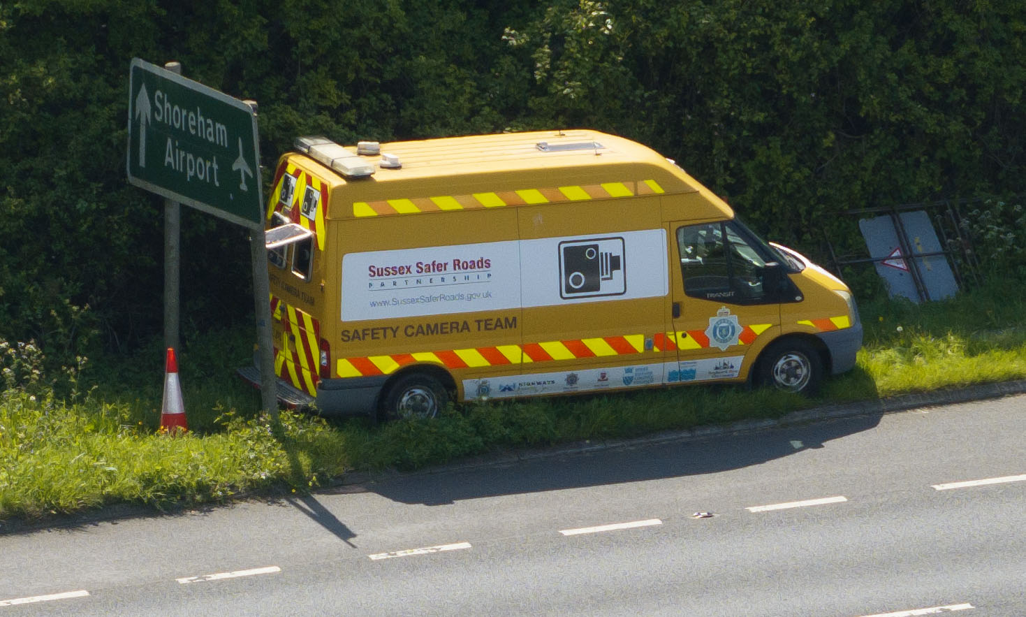 The van has been sneakily positioned directly behind a sign to catch people out