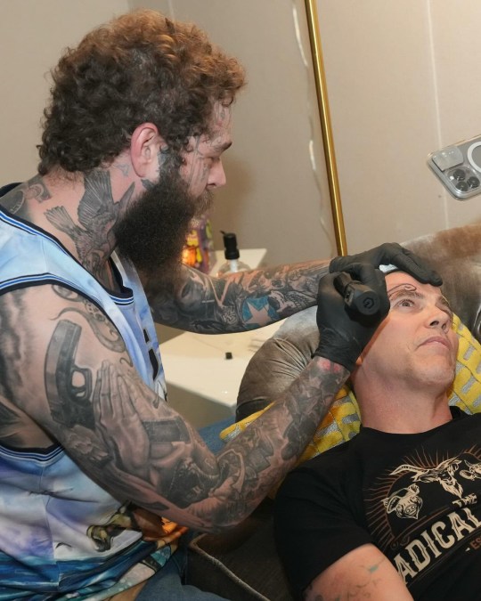 Post Malone tattoos a penis on Steve-O's face