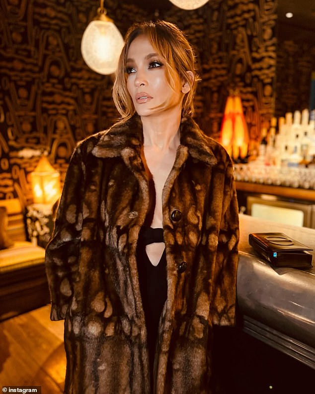 The eye-popping ensemble featured a midriff cut-out and a black bow under her bust. The On the Floor hitmaker completed the head-turning look with a warm brown fur coat