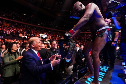 Jon Jones hands his UFC title to Donald Trump