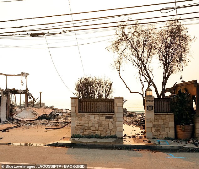 Smoke still rose from the carnage of the property as the sun began to set in the distance