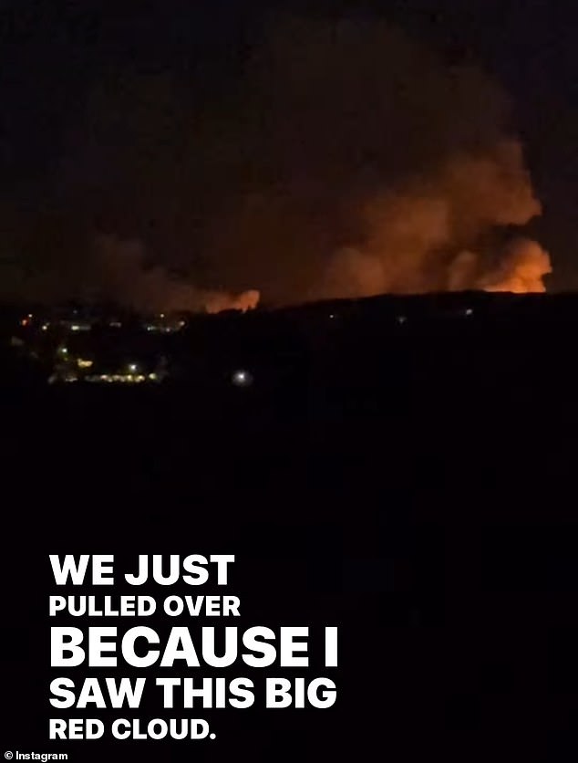 Sharing a clip of the flames, she said: 'Hey guys we just pulled over because I saw this big red cloud, the camera doesn't even do it justice, it literally looks like hell has taken over'