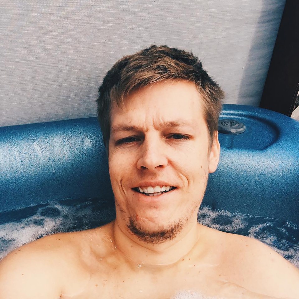 Man relaxing in a hot tub.